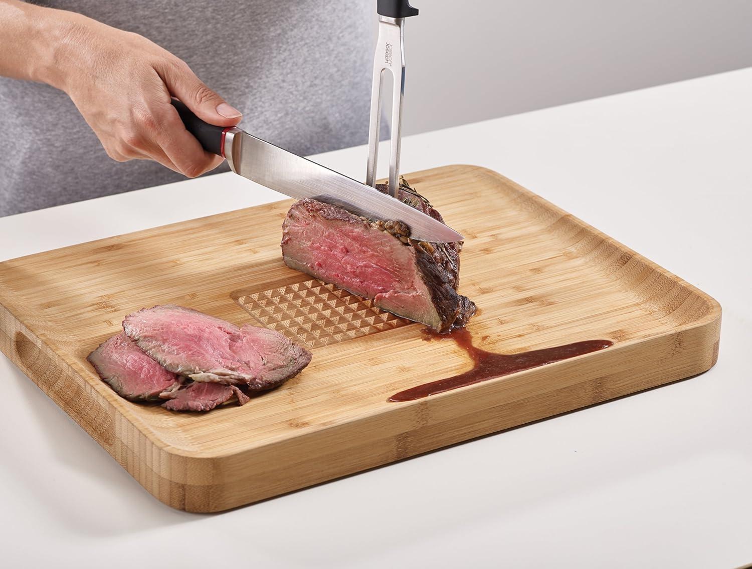 image:imageJoseph Joseph Cut amp Carve Bamboo Cutting Board with Food Grip and Angled Surface Yellow Large